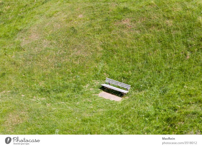 Bench in a meadow crater bench recess Lawn Meadow green Nature Summer Sun nobody Exterior shot Season Copy Space top Helgoland