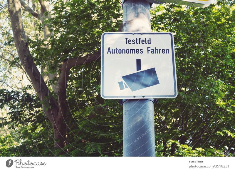 welcome to the test field for autonomous driving ... but please do not feel observed :-) sign Signage Road sign Exterior shot Signs and labeling Warning sign