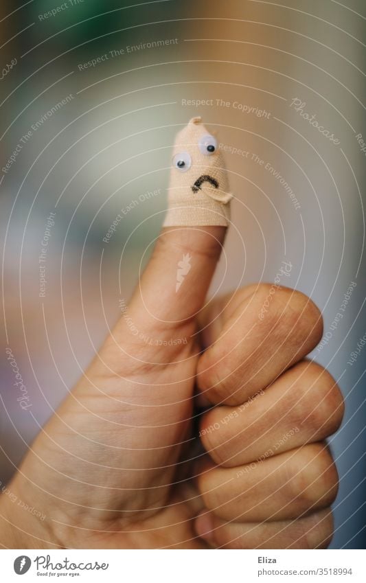 An injured thumb connected to a plaster with a sad face on it Thumb violation pavement Pain Face Child Laceration Expression Wound ally Emotions by hand
