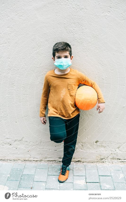 Little boy with a ball and protective mask. 2019-ncov allergy alone child childhood corona corona virus coronavirus covid-19 covid19 cute epidemic face