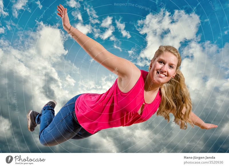 Young girl flies laughing high in the clouds Woman Sky Jump joyfully youthful Blue Summer fun Happiness Joy Freedom People Child outside Energy active person