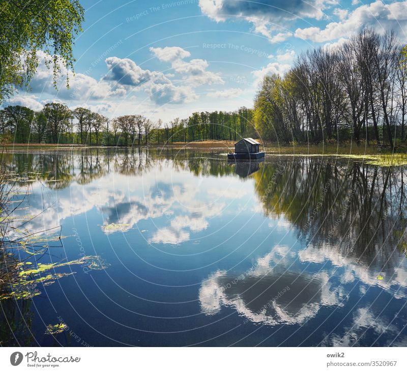 water level Lake Lakeside Sky Clouds Horizon Houseboat Water Surface of water Mirror image Reflection huts Nature Landscape Deserted Exterior shot Colour photo