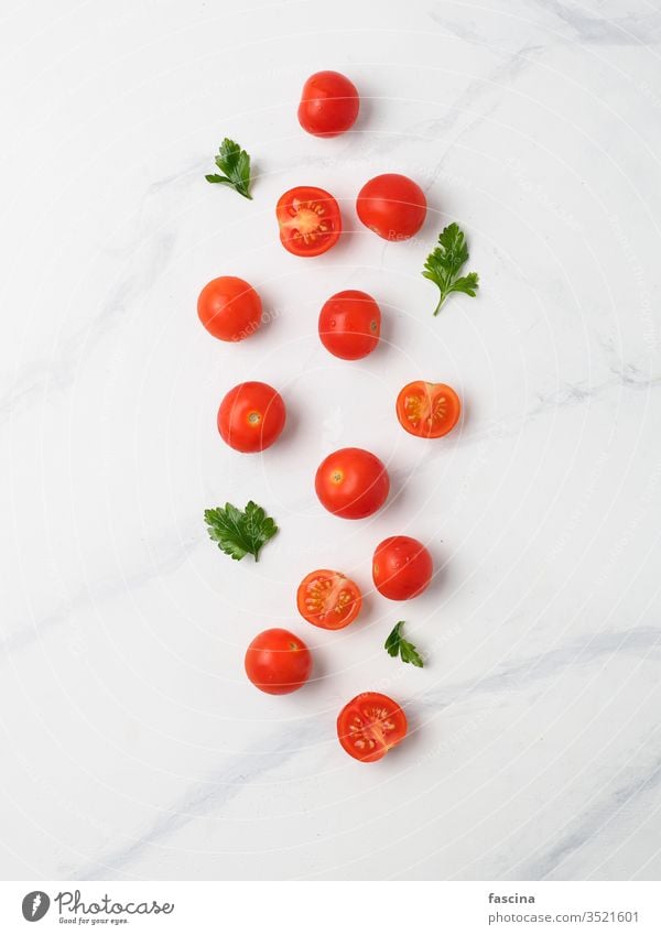 Cherry tomatoes on white marble table red cherry small top view fresh background vegetable food seeds vegetarian healthy organic grocery growing half diet