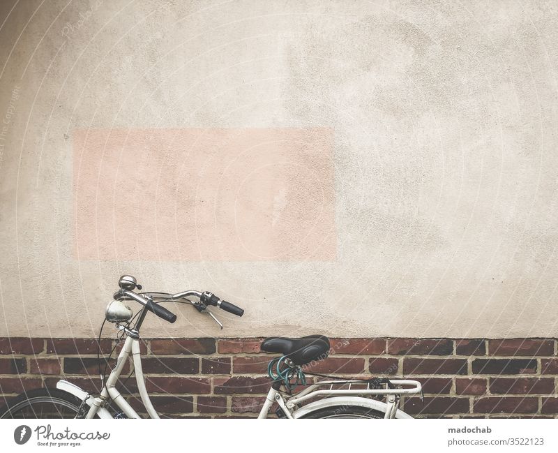 Discreet, skin-coloured rectangle steals the show from the bicycle Town urban Bicycle Wall (building) Facade trash Architecture Wall (barrier) built