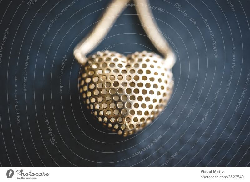 Metal mesh heart in a necklace accessory art and craft art work beautiful close up close-up closeup decoration design elegance fashion gift heart shape indoor