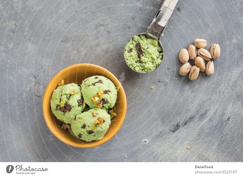 Ice cream with pistachio and chocolate background ball bowl cold creamy dairy decorated delicious dessert flavor food frozen fruit green homemade ice ice cream