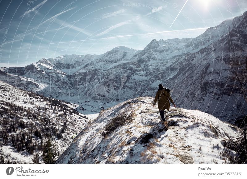 Man hikes in winter on the mountain in the Alps Tauern high tauern Bad Gastein Bad Hofgastein sports guest stone Salzburger Land Economy onset of winter Hiking