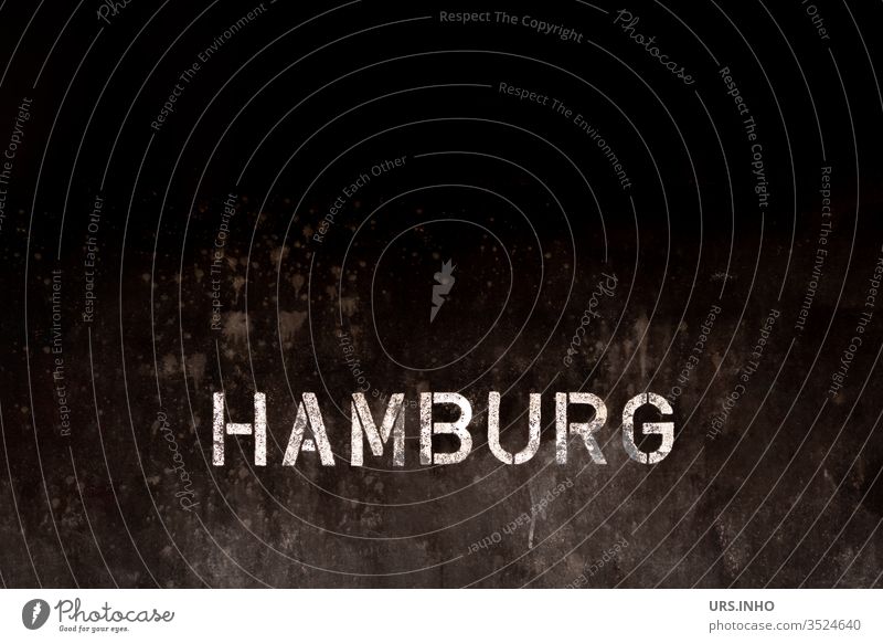 Text Hamburg as white characters on a structured background in black Characters Black White Hull upper-case letters authored imprinted Town Inscription dirt