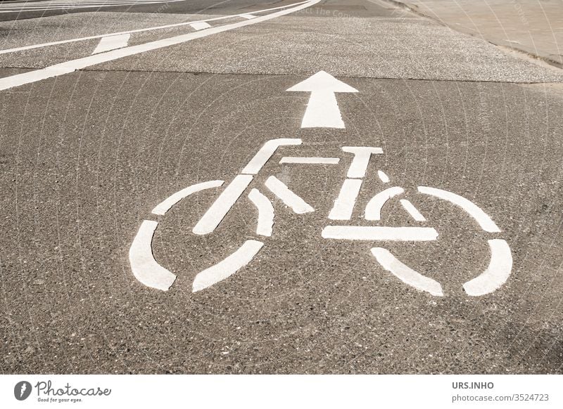 white bicycle symbol and arrow on a road Cycle path Street Traffic lane Arrow White Direction Road sign traffic symbol Signs and labeling Lane markings