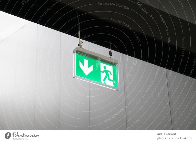 emergency exit or fire escape sign with running man symbol and arrow fire exit green signage directional evacuation rescue guidance safety pictorial pictogram