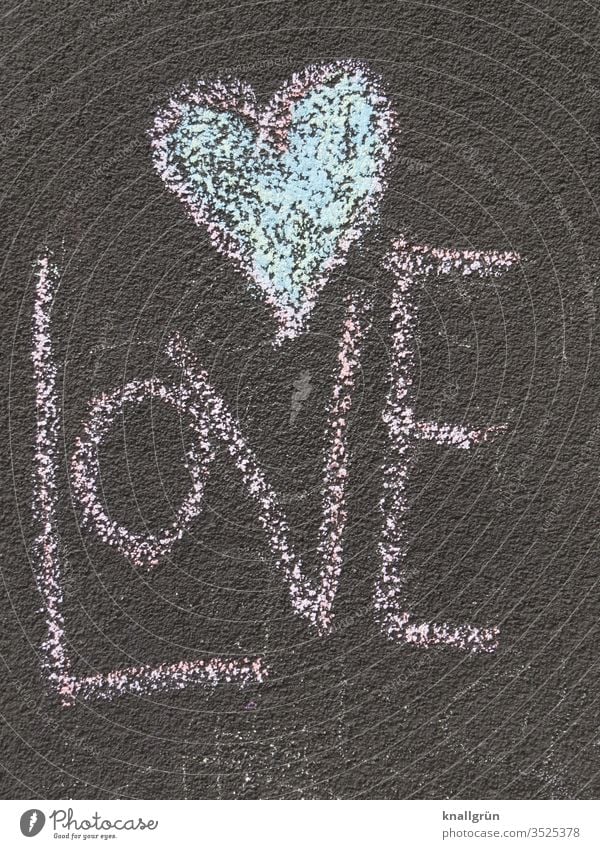 The word LOVE with a heart above it painted on the asphalt with street chalk Love Heart Asphalt Painting (action, artwork) Write Chalk Creativity Multicoloured