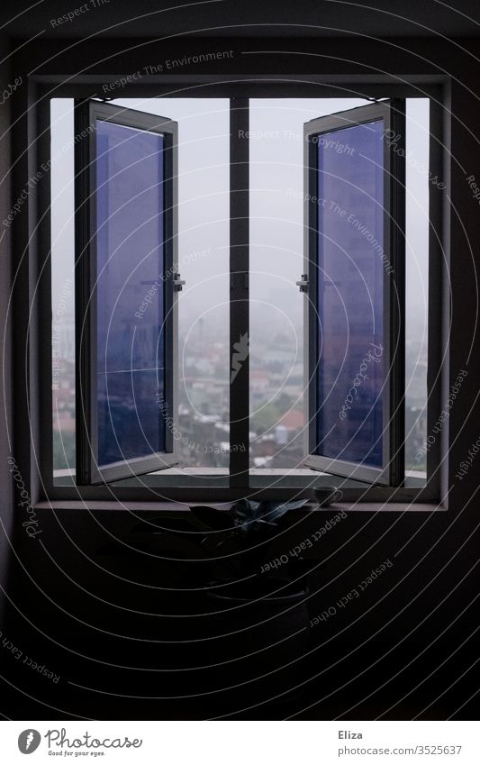 An open window with tinted panes and a view outside Window Open outlook purple Window panes Town Looking framed Deserted built foggy Sash window High-rise