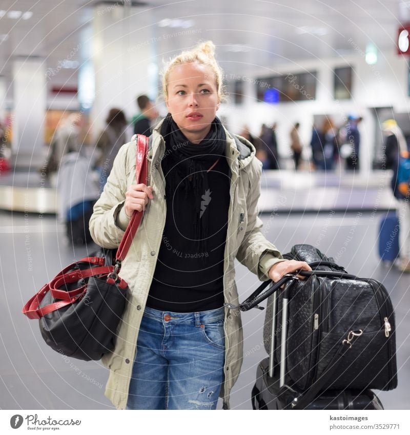 Female traveler transporting luggage in airport. woman schedule flight station departure gate arrival trip passenger baggage information girl female check in