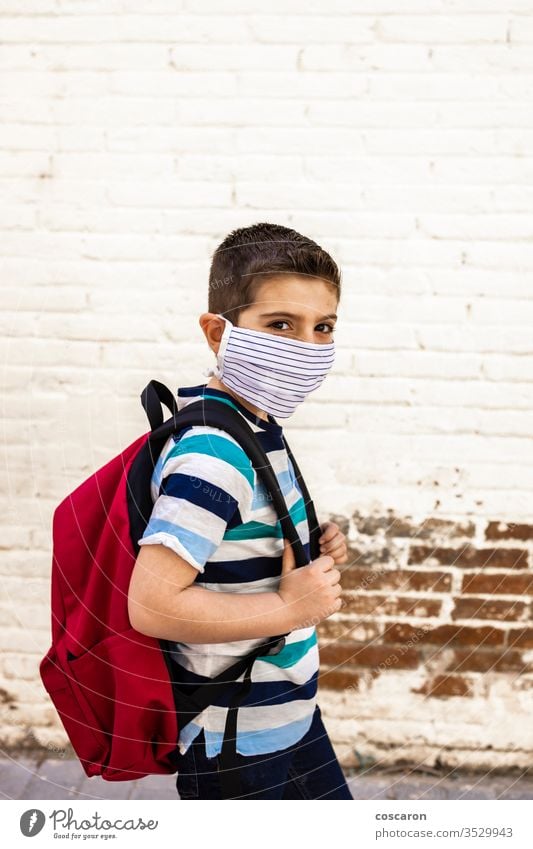 Little boy going to school with protective mask back to school backpack care child childhood city class closed college corona corona virus coronavirus covid-19