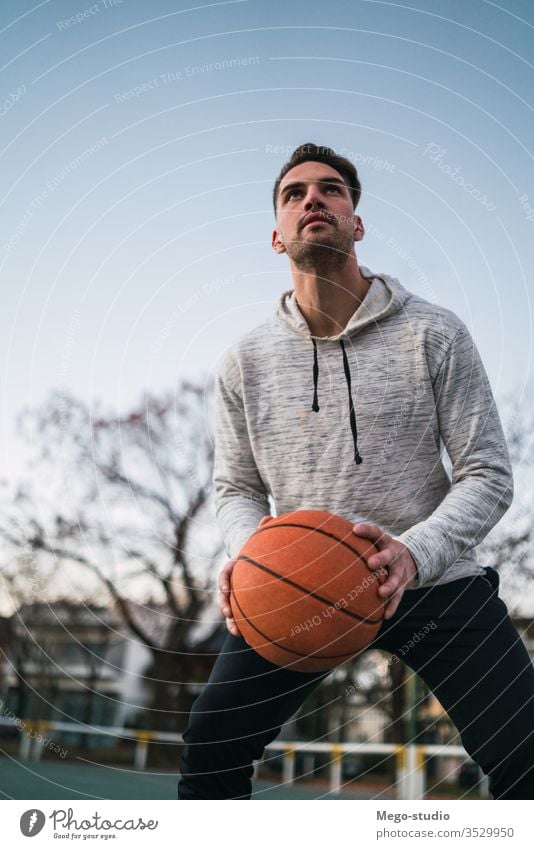 Young man playing basketball. training male young sport game player outdoor street hand athletic active boy playground club sporty workout leisure athlete fit