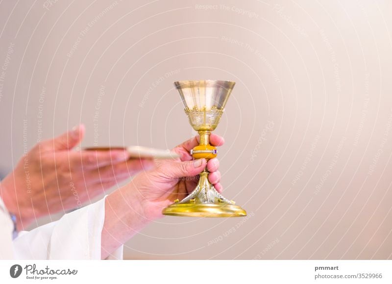 chalice with wine, blood of christ, and pyx with bread, body of christ, ready for the communion of the faithful risen mass consecration missal prayer francesco