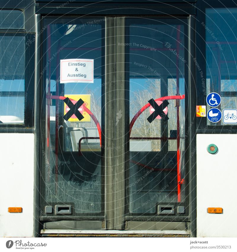 Public bus, currently the entry and exit door Piece of paper Sign Signs and labeling Detail Public transit city bus Means of transport Urban public transport