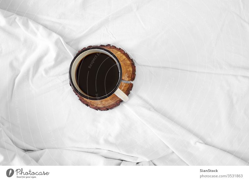 Coffee in bed, top view, coffee white cup shadow morning hotel blanket background home house room apartment lobby light beautiful isolated flower lifestyle