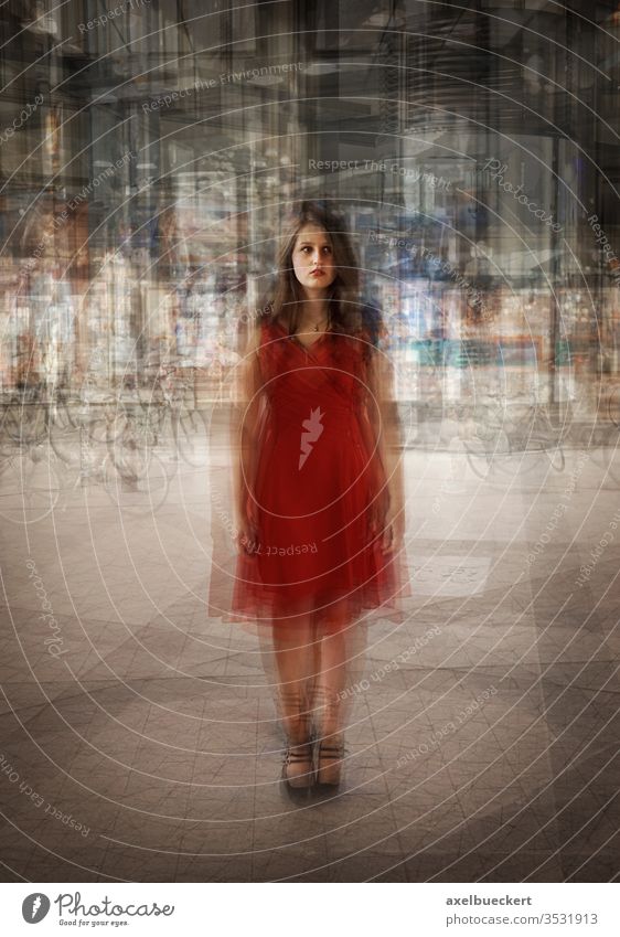 young woman stands alone in the city - multiple exposure Double exposure red dress Young woman Town Exterior shot urban on one's own Stand Dress
