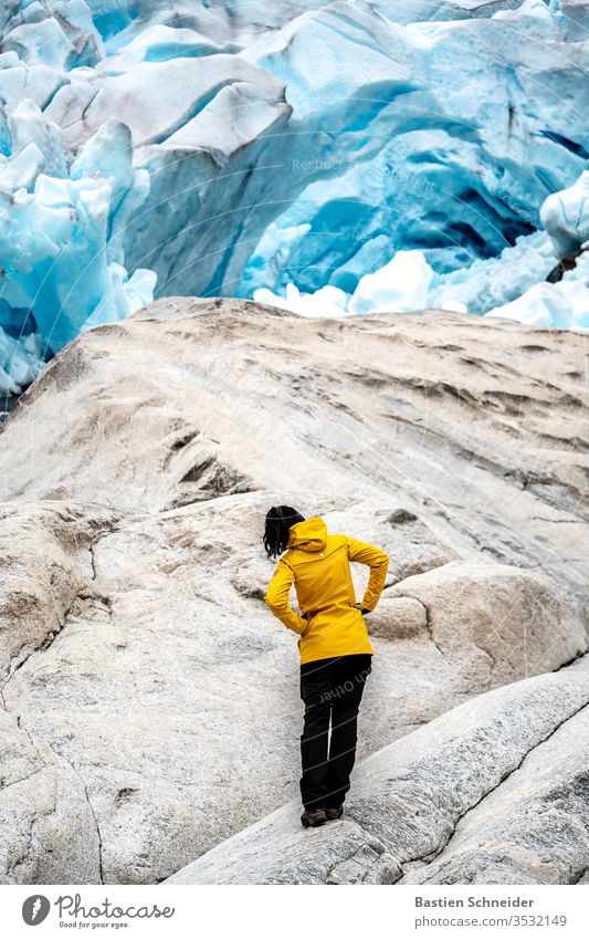 A lady is amazed at the view of the Nigardsbreen, Jostedalsbreen in Norway Glacier ice norge Uniqueness glacial lake Respect Self-confident wanderlust outdoor