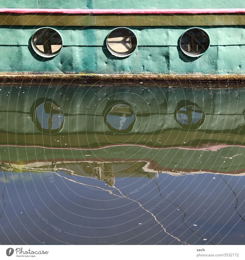 Detail of an old boat with reflection in the water Town Blue Waves Spree Reflection Mirror image Water Berlin Navigation ship River Cutter Colour photo