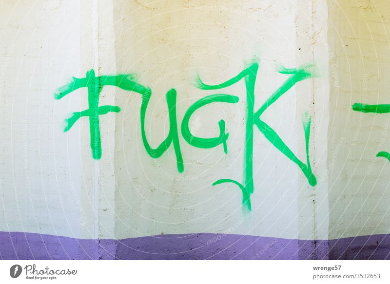 Fuck | The Graffito Fuck sprayed with green paint on a beige wall fuck Word writing Colour spray paint Spray Graffiti Wall (building) Characters Deserted Day