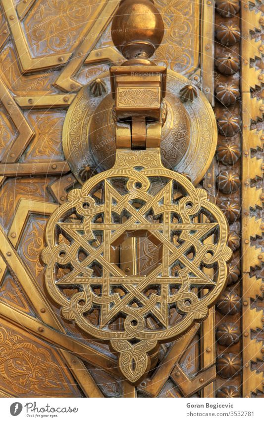Detail from the Royal Palace in Fez, Morocco building arabic morocco texture geometry muslim pattern decoration decorative fez yellow metal palace royal door