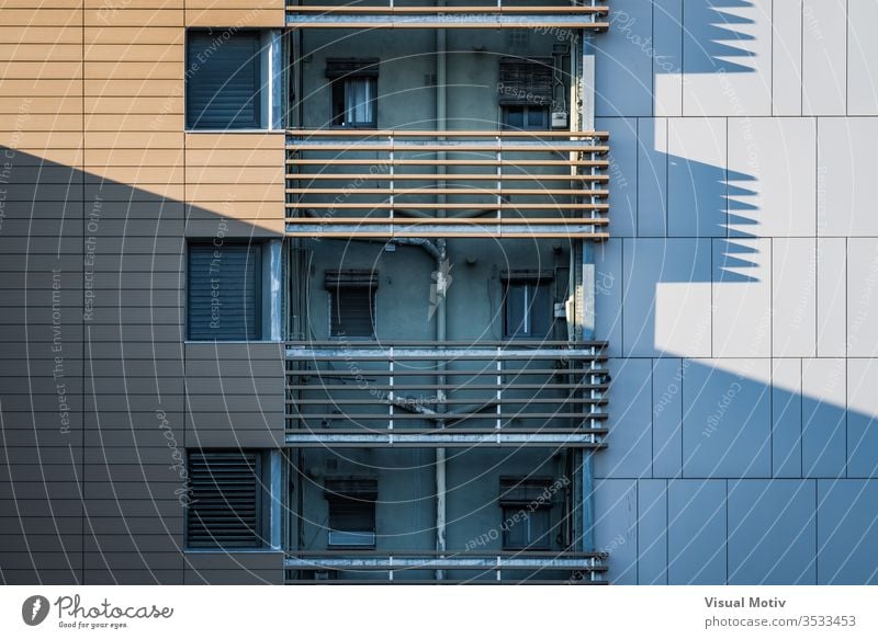 Shadows of the facade of a residential building at the afternoon light windows balconies architecture architectural architectonic urban concrete structure