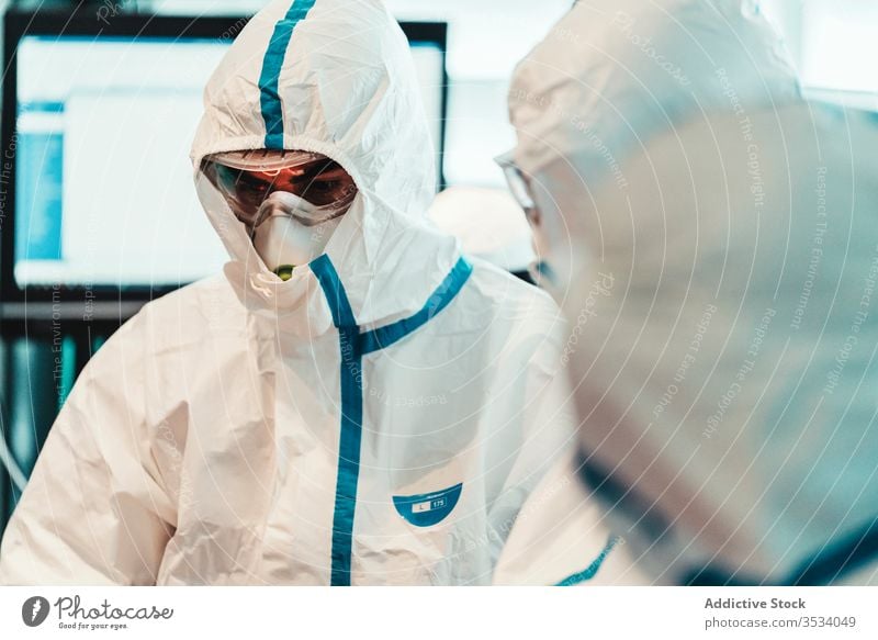 Serious doctor in protective mask during operation in clinic uniform specialist serious professional work health care medicine treat confident sterile staff