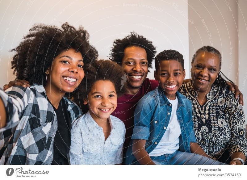 Multigenerational family taking selfie at home. together happy multigenerational cute smile grandmother love memories four black son lifestyle photo cheerful