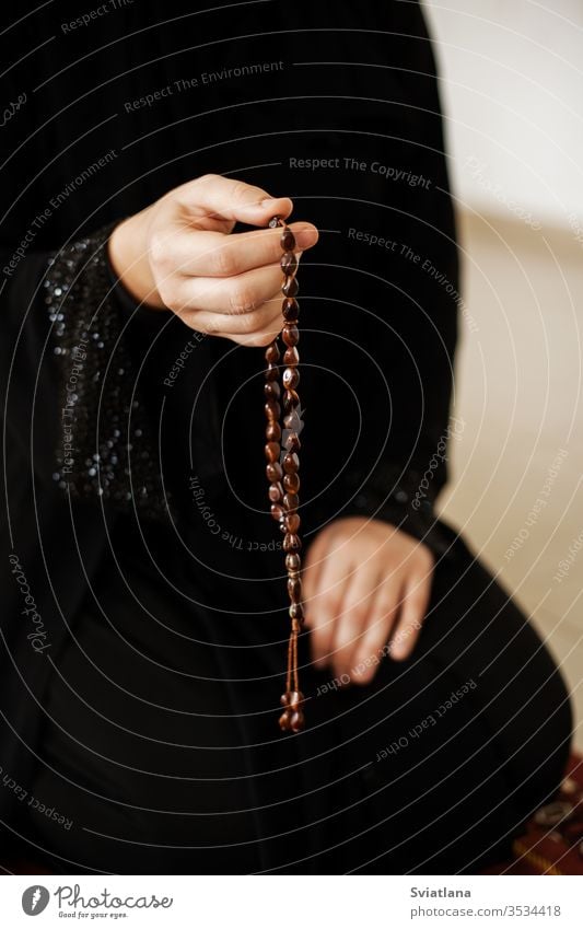 Prayer hands of a woman holding a rosary beads muslim symbol pray religion faith holy islam prayer allah god meditation Ramadan traditional white arabic