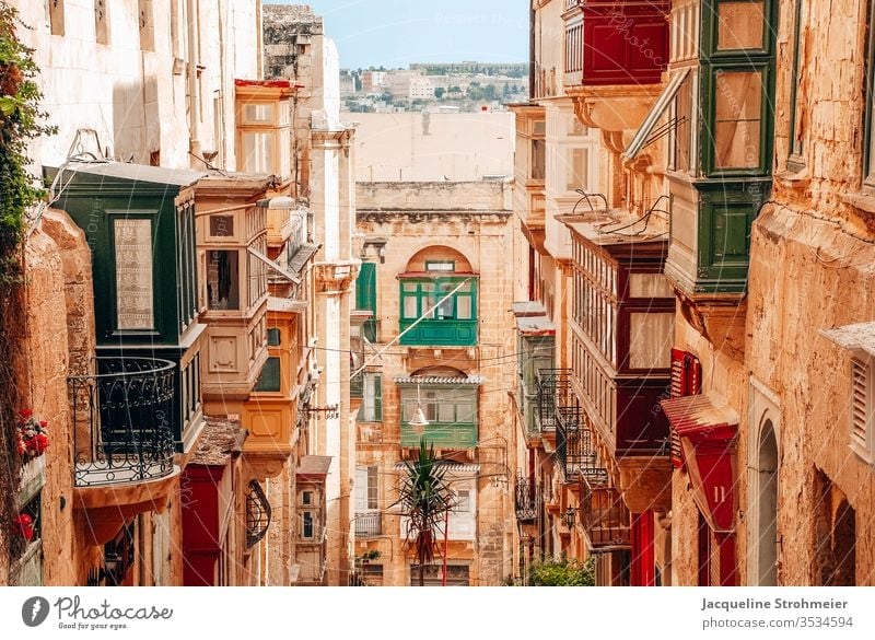 Colorful Streets of Valletta, Malta valleta malta maltese old town sandstone sandstone building architecture balcony colorful balcony colorful buildings