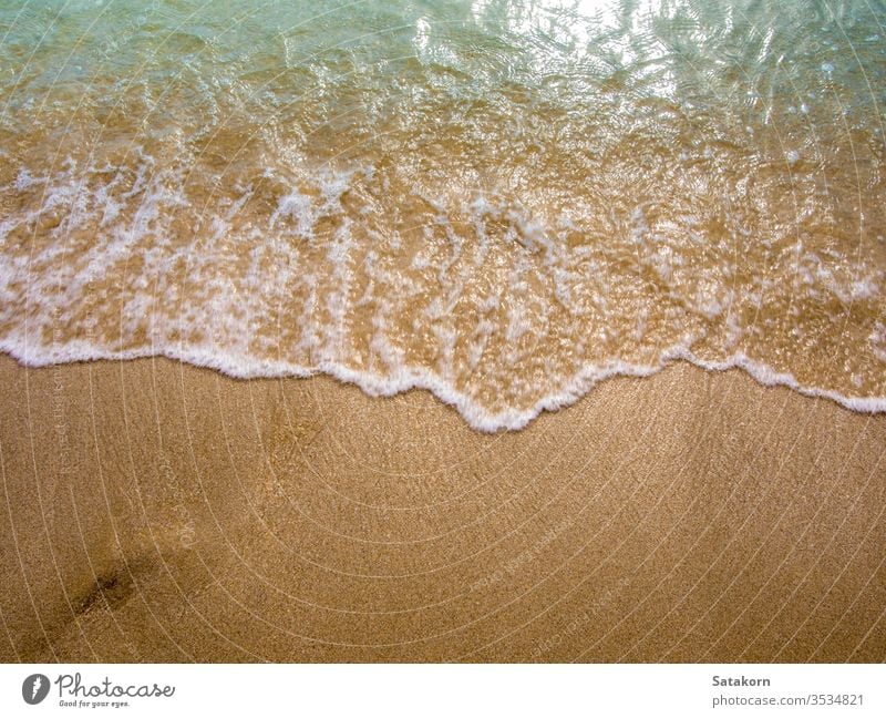 White bubble of Sea wave on the beach sand fine sea ocean ebb sun nature blue tide splash movement clear tropical relax foam beautiful relaxation summer