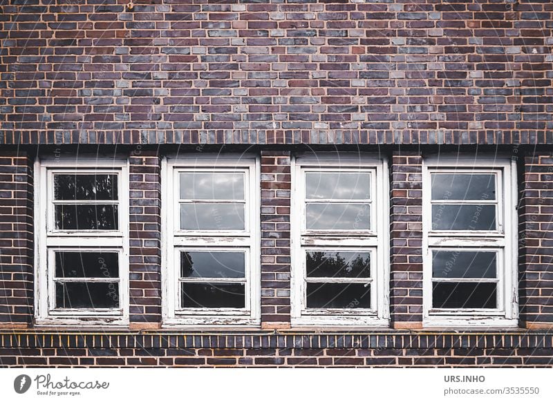 old flaked muntin windows in a clinker facade geometric Symetric Geometry Architecture symmetry façade Wooden window wood flaking paint Lattice window Window