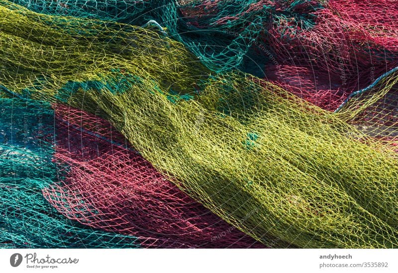 Fishing nets leave to dry in the morning sun abstract Art Background backgrounds catch close up color colored colorful commercial fishing net complexity