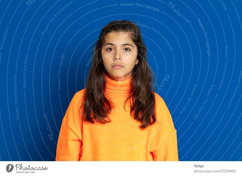 Preteen girl with yellow jersey preteen blue scared surprised horrified emotion gesture worried excited problem portrait expression female people person pretty