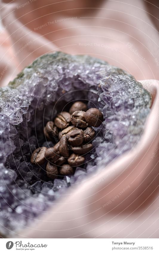 closeup of an amethyst geode with coffee beans inside gemology mineral collection alternative healing spiritual geologist mineralogy amethyst phantom