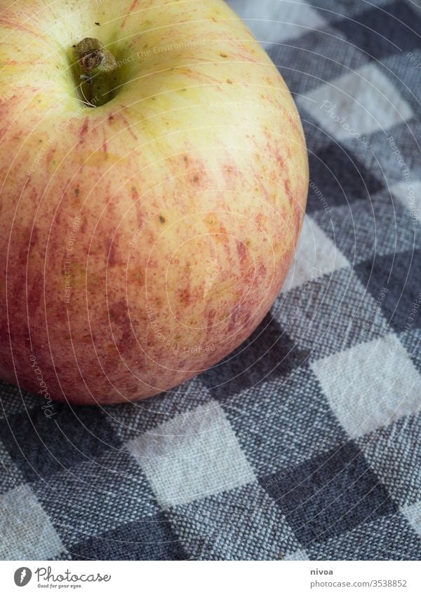 Close up of an apple Apple Detail Fruit vitamins Kitchen kitchen towel Nutrition Colour photo Healthy Fresh Delicious Food Vegetarian diet Diet Red
