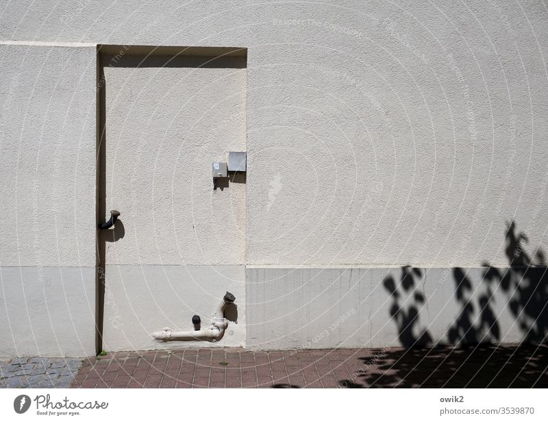 safe Wall (building) House (Residential Structure) door quad Simple Sunlight Shadow Shade of a tree Sharp-edged Entrance bricked up Deserted Exterior shot