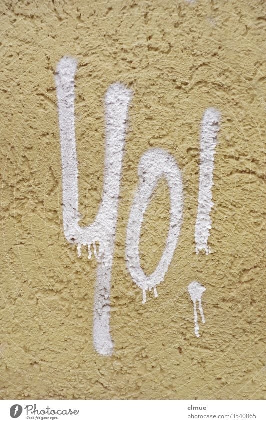 Text "Yo !" with white lettering on rough plastered wall yo Approval salute pass jargon youth language English Wall (building) bailer Plastered announcement