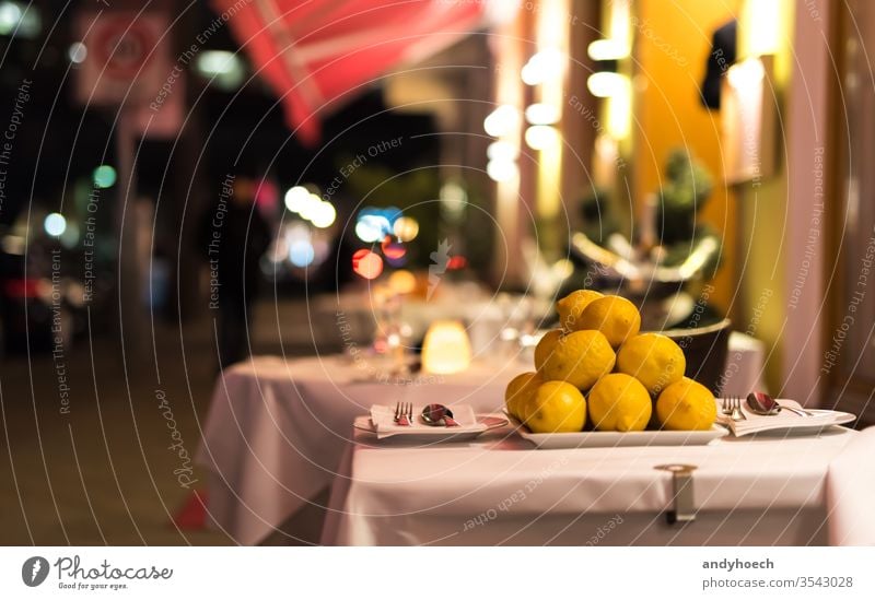 A table outside in the restaurant in the evening against ambiance Berlin cafe celebration citric city covered decoration design dining dinner empty event food