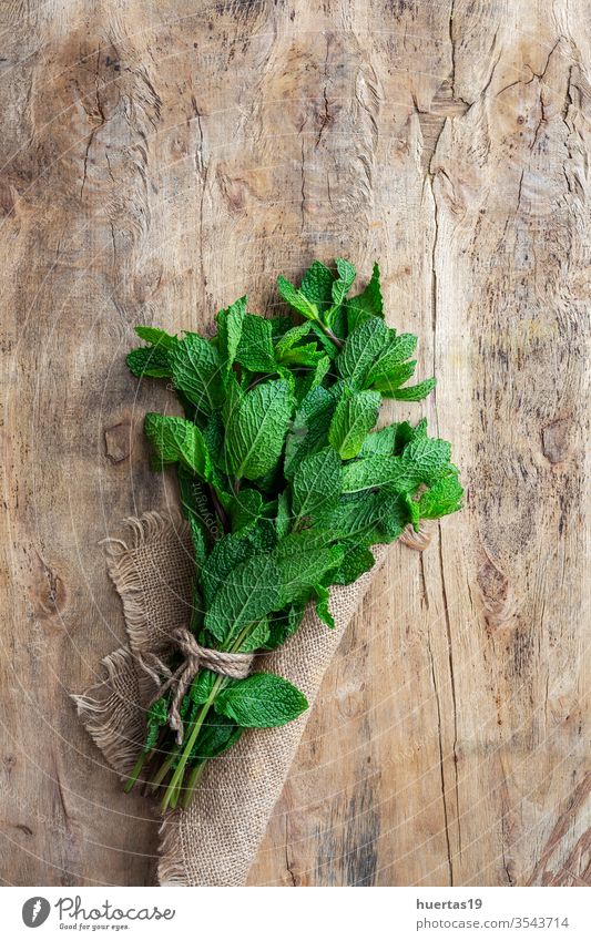 fresh aromatic herbs from above on old wood  background food organic green ingredient mint oregano parsley chive rosemary basil estragon leaf plant bouquet