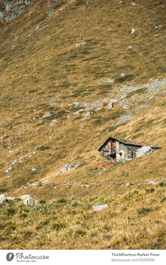 Cottage on the slope Meadow Hut stone hut mountain Alps Higher Engadin along the elevation hike stones