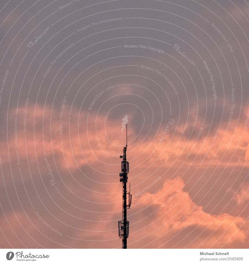Transmitter mast in front of a cloudy background Communicate Antenna Technology Sky Telecommunications Deserted Day Copy Space top Exterior shot Colour photo