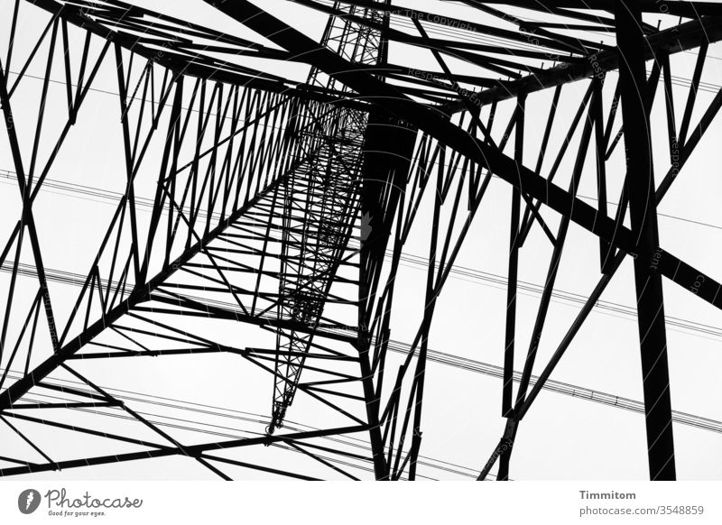 Stand under the power pole and look up Electricity pylon Pole Metal Construction Sky Energy industry Technology High voltage power line electricity