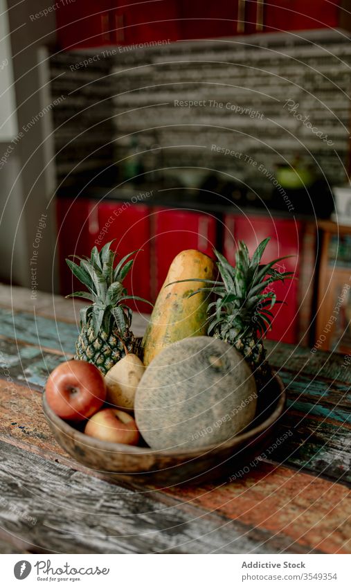 Exotic fruits on table of terrace in summer exotic bowl melon apple pineapple fresh wooden bali indonesia tropical organic raw healthy food delicious vitamin