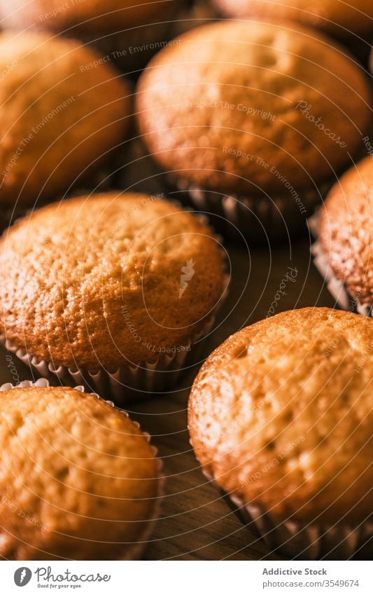Ready to eat baked muffins delicious confectioner cook muffin case homemade kitchen tasty table dessert bakery product paper muffin liner closeup wooden ready