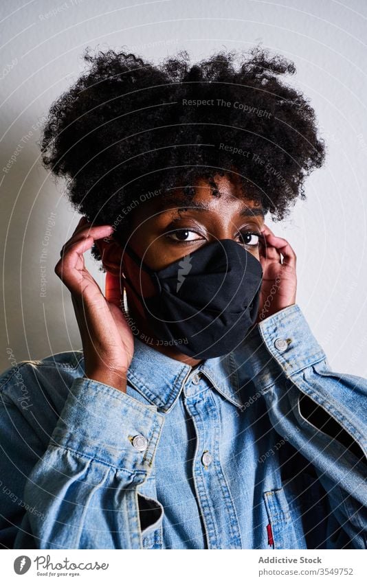 Young black woman in protective mask coronavirus stay home covid young african american ethnic female afro casual safety support caution covid 19 contemporary