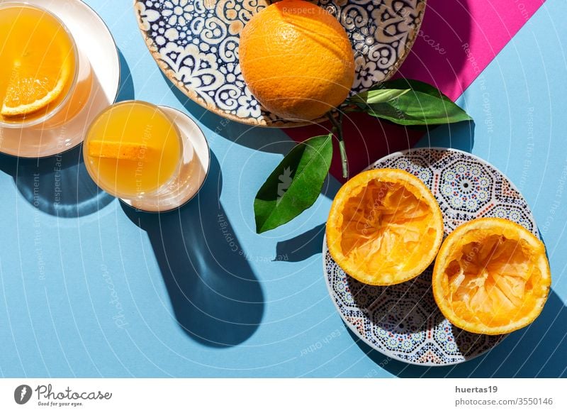 orange juice from above on colored backgrounds. oranges fresh fruit healthy food citrus ripe drink natural slice sunligth juicy beverage glass summer table