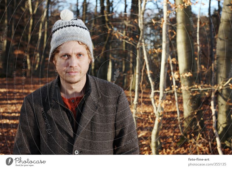 Man in the forest Masculine Adults 1 Human being 30 - 45 years Autumn Tree Forest Cap Blonde Funny Crazy Stupid Whimsical Coat Colour photo Exterior shot